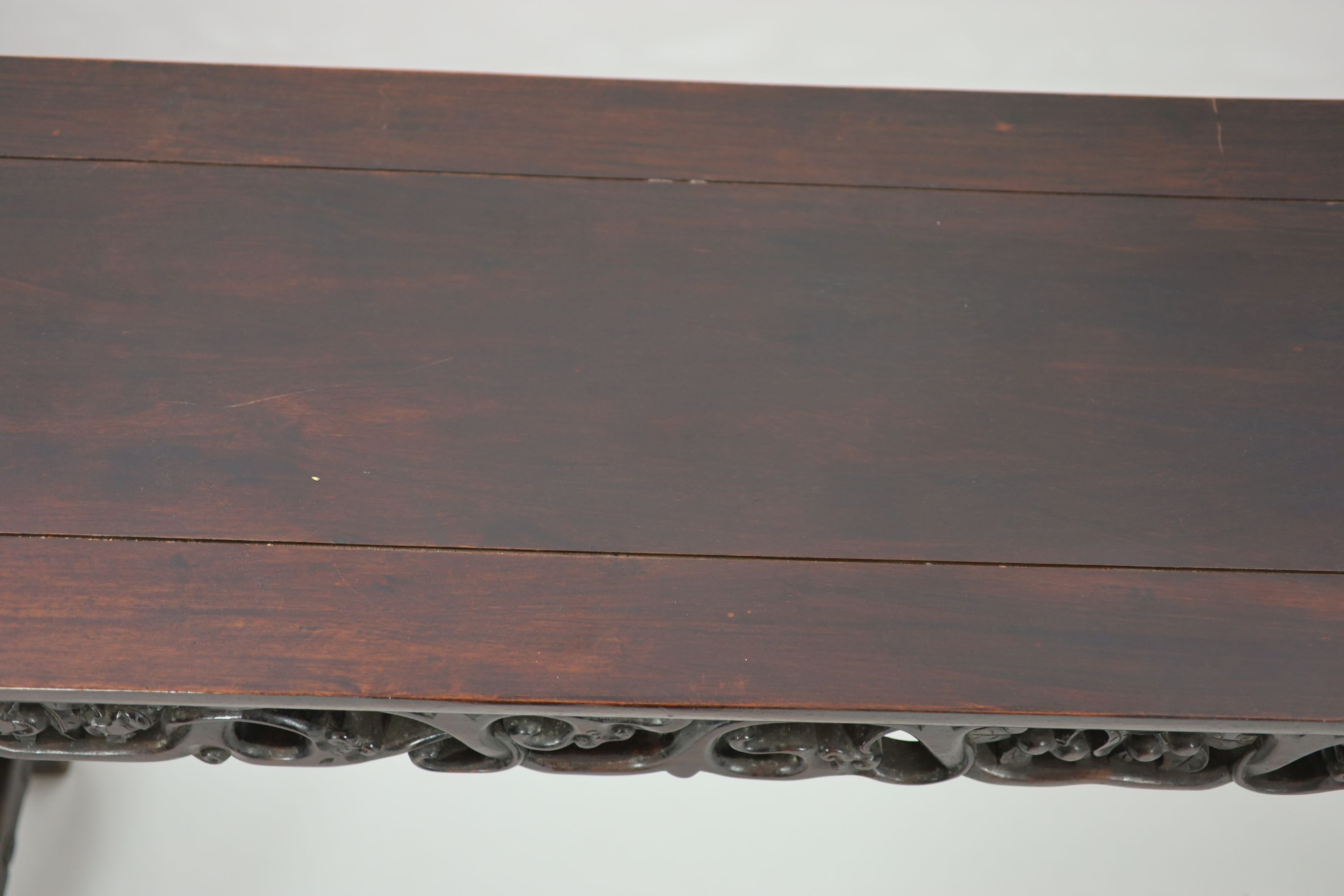 A large Chinese hongmu altar table, 19th century H 110cm. W 281cm. D 51.5cm.
